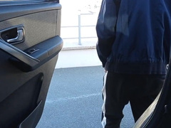 boy jerks off in a shopping mall parking lot